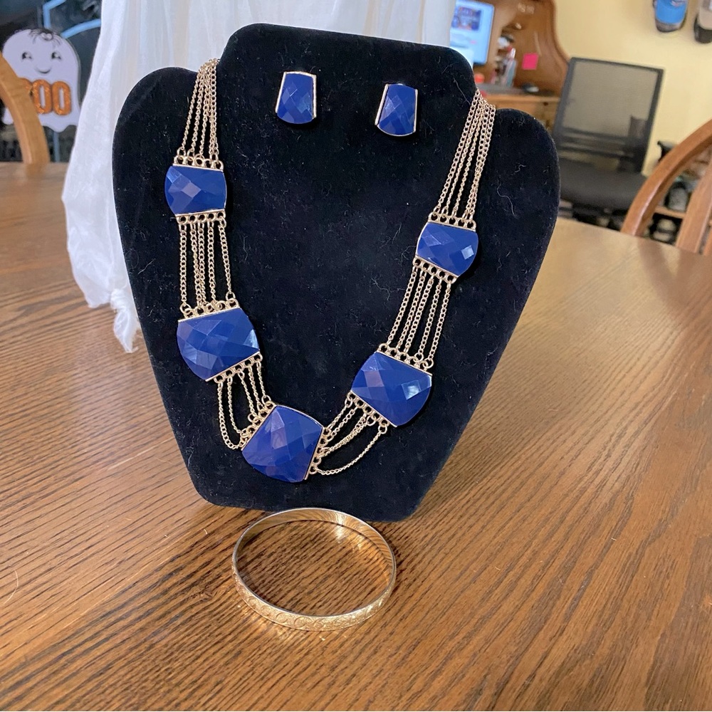 Necklace, earrings and bracelet.  Not branded